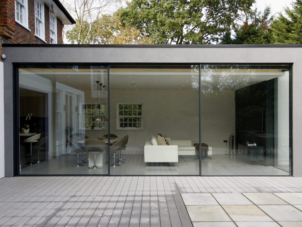 sleek modern home extension with glass walls