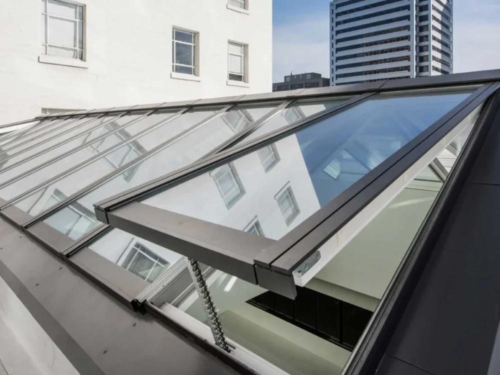 ventilated-rooftop-glass-skylight Sloped rooftop skylight with open glass panel